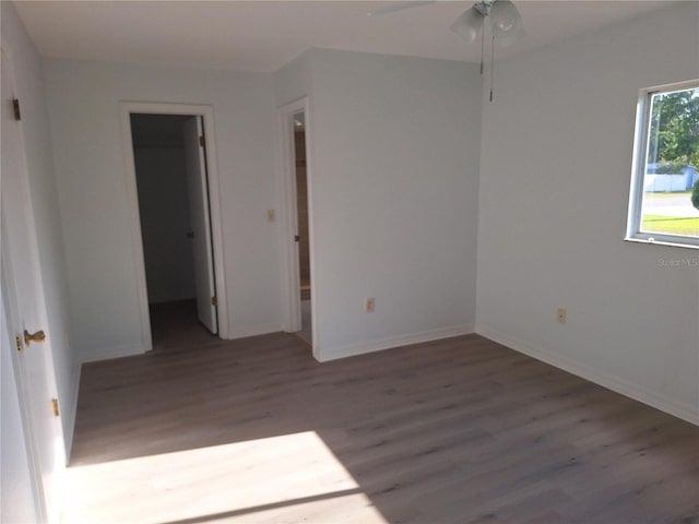 11282 SW 62nd Avenue Rd, Ocala, FL 34476 - unfurnished room with wood finished floors, baseboards, and a ceiling fan
