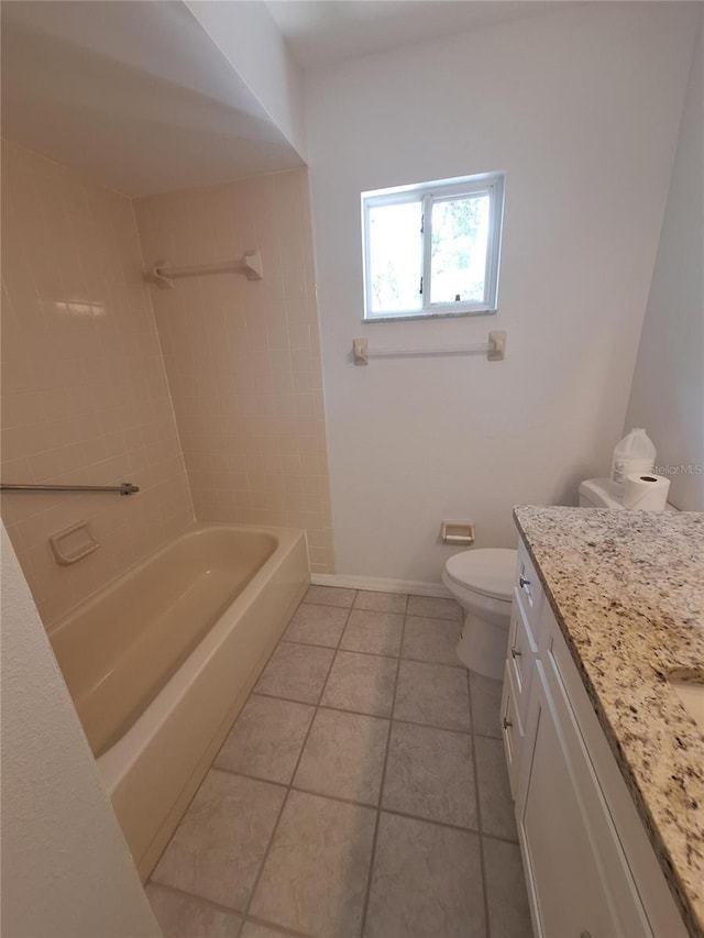 11282 SW 62nd Avenue Rd, Ocala, FL 34476 - bathroom featuring vanity, toilet, tile patterned flooring,  shower combination, and baseboards