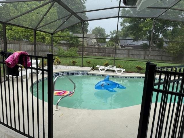 2514 Dovetail Dr, Ocoee, FL 34761 - view of pool featuring a fenced backyard, glass enclosure, and a patio