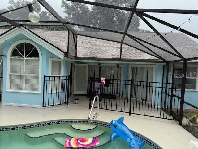 2514 Dovetail Dr, Ocoee, FL 34761 - outdoor pool with a patio and a lanai