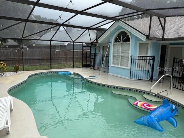 2514 Dovetail Dr, Ocoee, FL 34761 - view of pool featuring a patio and a lanai