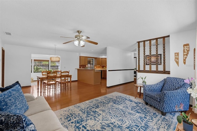 1830 W Clinton Dr, Saint Cloud, FL 34769 - living room with ceiling fan and wood finished floors