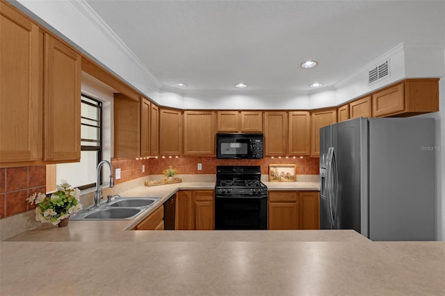 1830 W Clinton Dr, Saint Cloud, FL 34769 - kitchen featuring black appliances, a sink, light countertops, backsplash, and crown molding