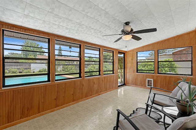 1830 W Clinton Dr, Saint Cloud, FL 34769 - sunroom featuring wooden walls, baseboards, ceiling fan, and vaulted ceiling