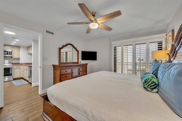5207 S Atlantic Ave Unit 225, New Smyrna Beach, FL 32169 - bedroom with light wood-style flooring, baseboards, and ceiling fan