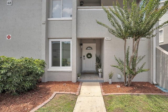 5635 Blue Shadows Ct Unit 3, Orlando, FL 32811 - doorway to property featuring stucco siding