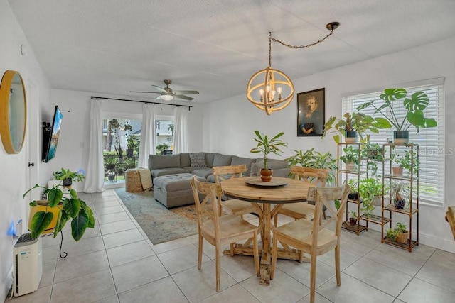 5635 Blue Shadows Ct Unit 3, Orlando, FL 32811 - dining space with plenty of natural light, a chandelier, and light tile patterned flooring