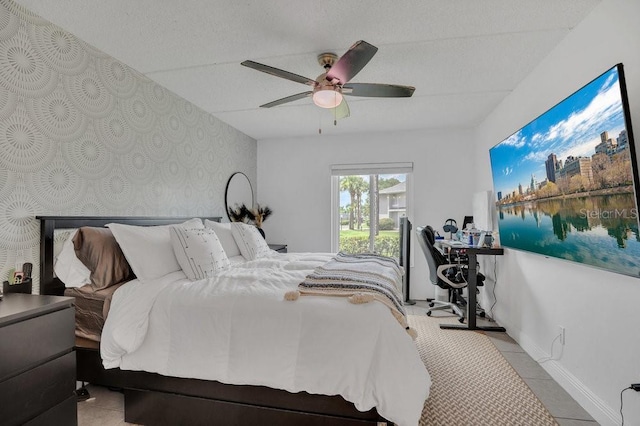 5635 Blue Shadows Ct Unit 3, Orlando, FL 32811 - bedroom featuring wallpapered walls, ceiling fan, tile patterned floors, and an office area