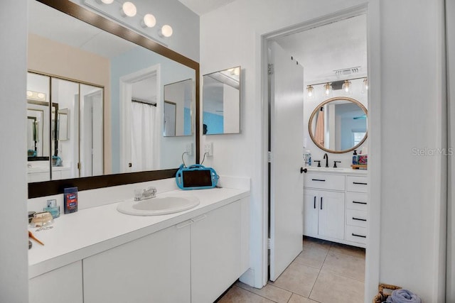 5635 Blue Shadows Ct Unit 3, Orlando, FL 32811 - bathroom featuring vanity and tile patterned flooring