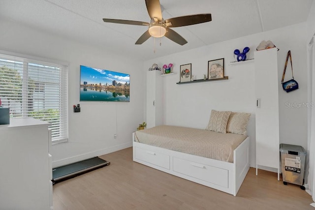 5635 Blue Shadows Ct Unit 3, Orlando, FL 32811 - bedroom featuring light wood-style flooring and a ceiling fan