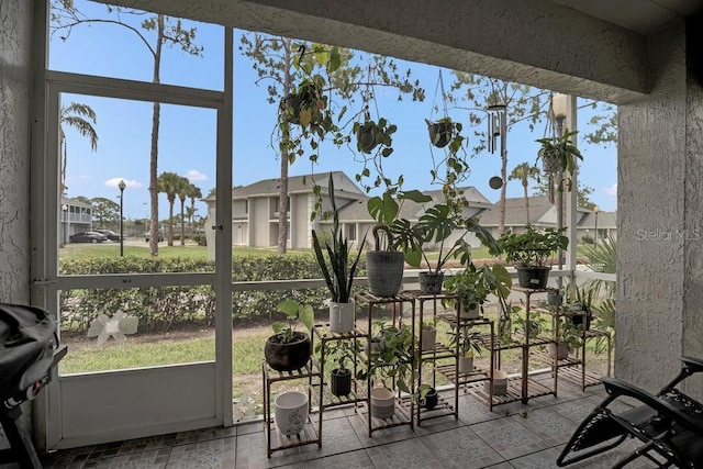 5635 Blue Shadows Ct Unit 3, Orlando, FL 32811 - sunroom featuring plenty of natural light and a residential view