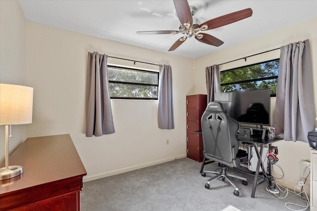 office featuring carpet flooring, ceiling fan, and baseboards