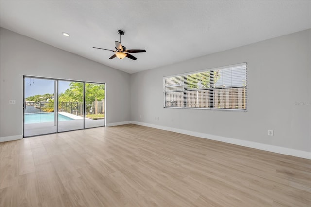 6 Cimmaron Dr, Palm Coast, FL 32137 - unfurnished room featuring lofted ceiling, ceiling fan, baseboards, light wood-style flooring, and recessed lighting