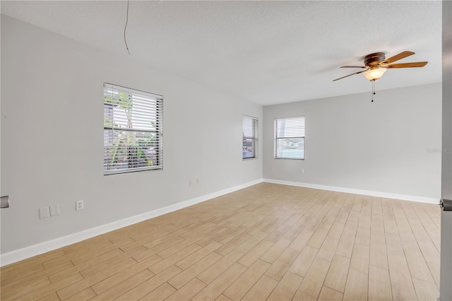 6 Cimmaron Dr, Palm Coast, FL 32137 - spare room with ceiling fan, light wood-type flooring, and baseboards