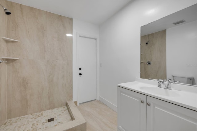 6 Cimmaron Dr, Palm Coast, FL 32137 - bathroom with a tile shower, vanity, and toilet