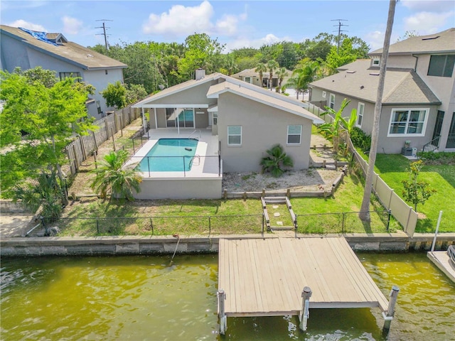 6 Cimmaron Dr, Palm Coast, FL 32137 - rear view of property with a fenced backyard, a patio, a water view, and stucco siding