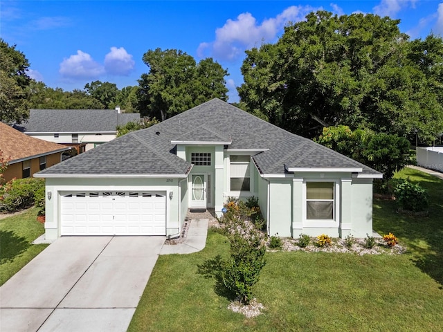 2710 Autumn Ln, Eustis, FL 32726 - ranch-style house with a shingled roof, a garage, stucco siding, driveway, and a front yard