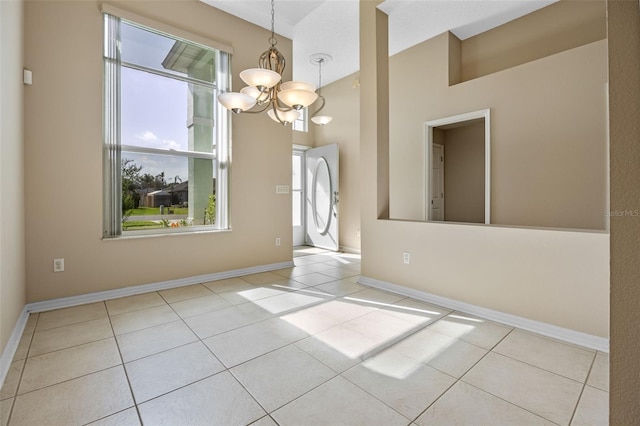 2710 Autumn Ln, Eustis, FL 32726 - unfurnished dining area with tile patterned flooring, a chandelier, and baseboards