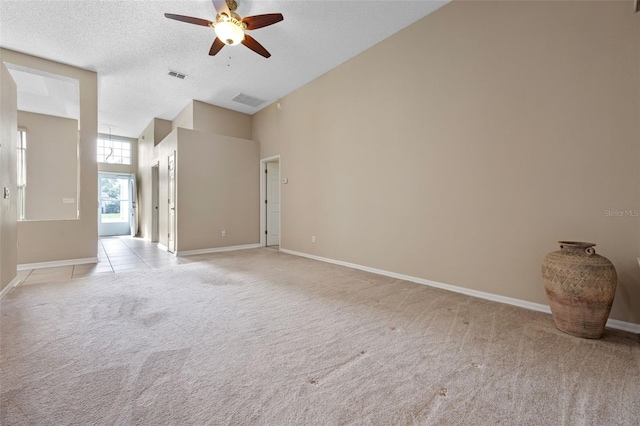 2710 Autumn Ln, Eustis, FL 32726 - unfurnished room featuring light carpet, ceiling fan, high vaulted ceiling, baseboards, and a textured ceiling