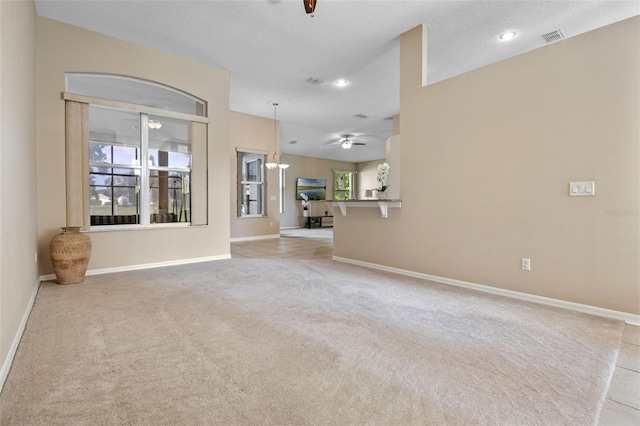 2710 Autumn Ln, Eustis, FL 32726 - unfurnished living room with ceiling fan, light colored carpet, baseboards, recessed lighting, and a textured ceiling