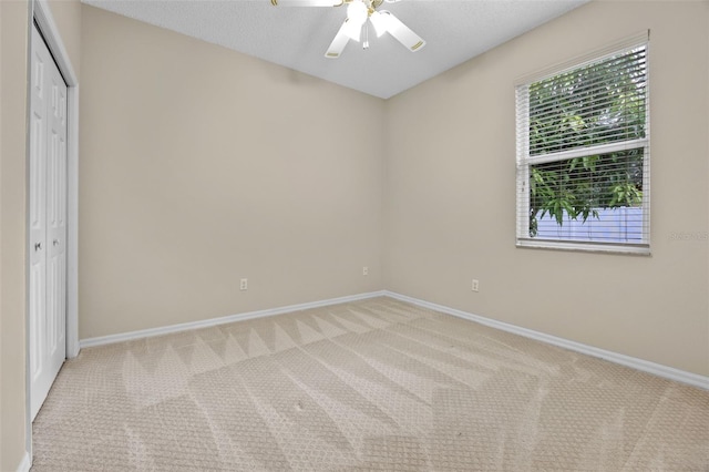 2710 Autumn Ln, Eustis, FL 32726 - unfurnished bedroom featuring carpet, baseboards, a closet, and a ceiling fan