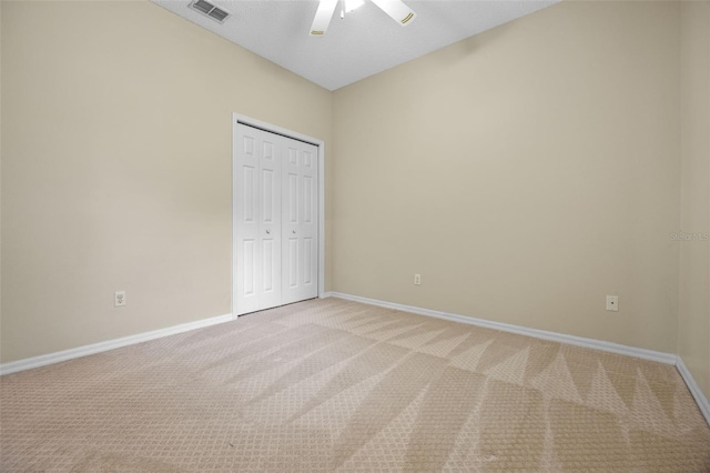 2710 Autumn Ln, Eustis, FL 32726 - unfurnished bedroom featuring light carpet, baseboards, a closet, and a ceiling fan