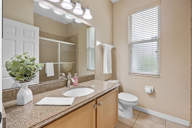 2710 Autumn Ln, Eustis, FL 32726 - full bathroom featuring a shower stall, vanity, toilet, tile patterned flooring, and baseboards