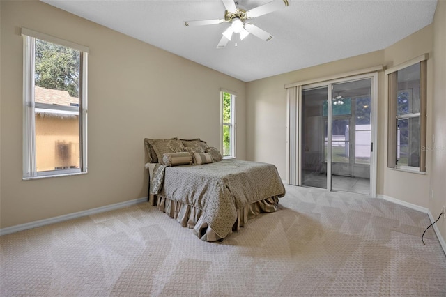 2710 Autumn Ln, Eustis, FL 32726 - bedroom with access to outside, carpet floors, baseboards, and ceiling fan