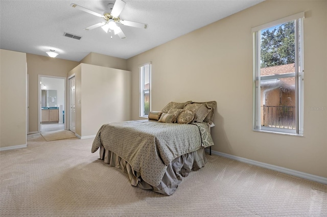 2710 Autumn Ln, Eustis, FL 32726 - bedroom featuring carpet, baseboards, multiple windows, and ensuite bath