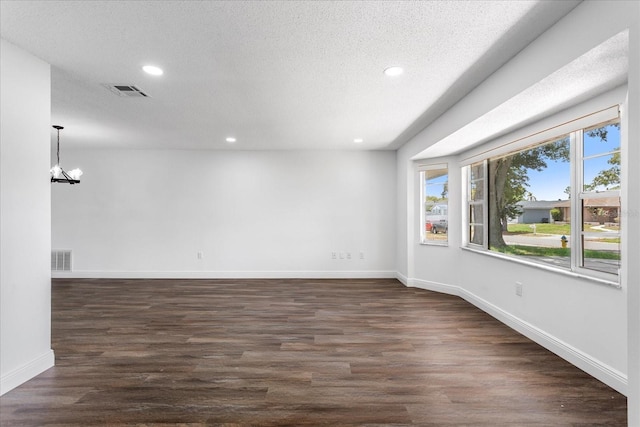611 Lakespur Ln, Altamonte Springs, FL 32714 - empty room with recessed lighting, baseboards, a chandelier, dark wood-style floors, and a textured ceiling
