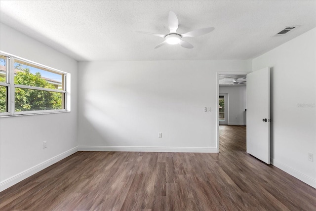 611 Lakespur Ln, Altamonte Springs, FL 32714 - empty room featuring a ceiling fan, wood finished floors, healthy amount of natural light, a textured ceiling, and baseboards