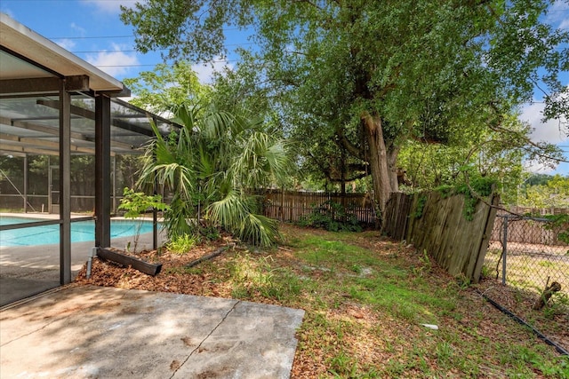 611 Lakespur Ln, Altamonte Springs, FL 32714 - fenced backyard with a patio area and glass enclosure
