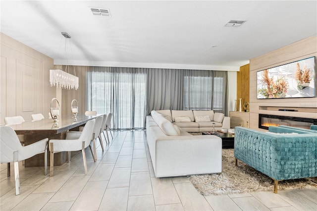 8833 Cruden Bay Ct, Davenport, FL 33896 - living room featuring wood walls