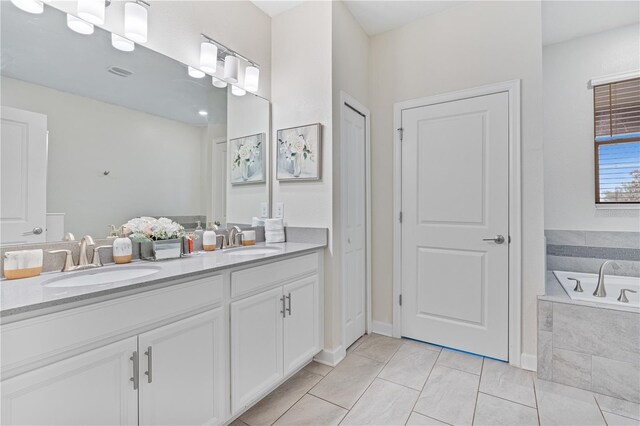 8833 Cruden Bay Ct, Davenport, FL 33896 - bathroom with double vanity and a garden tub