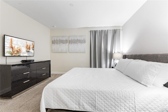 8833 Cruden Bay Ct, Davenport, FL 33896 - bedroom featuring light colored carpet and baseboards