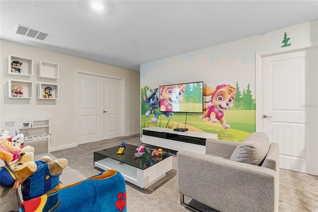 8833 Cruden Bay Ct, Davenport, FL 33896 - living room featuring carpet and baseboards