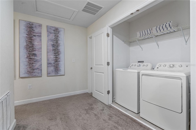 8833 Cruden Bay Ct, Davenport, FL 33896 - laundry room with separate washer and dryer, light carpet, attic access, and baseboards