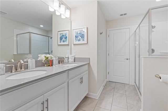 8833 Cruden Bay Ct, Davenport, FL 33896 - bathroom with double vanity, a shower stall, and baseboards