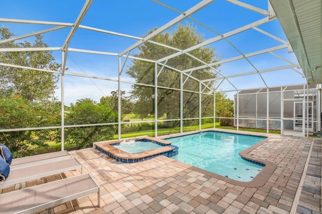 8833 Cruden Bay Ct, Davenport, FL 33896 - view of swimming pool featuring a patio area, a pool with connected hot tub, and glass enclosure