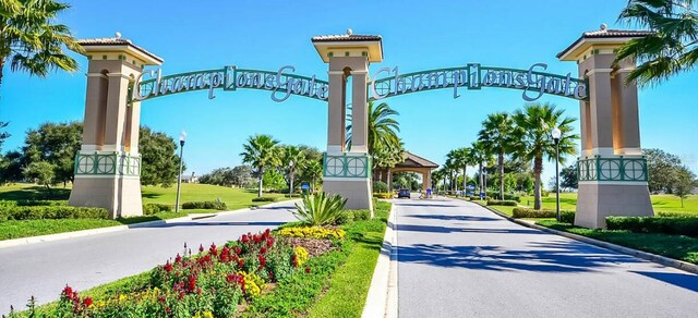 8833 Cruden Bay Ct, Davenport, FL 33896 - view of asphalt street with curbs and street lighting