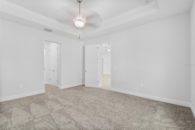 304 N Jungle Rd, Geneva, FL 32732 - unfurnished room featuring a ceiling fan, a raised ceiling, ornamental molding, carpet floors, and baseboards