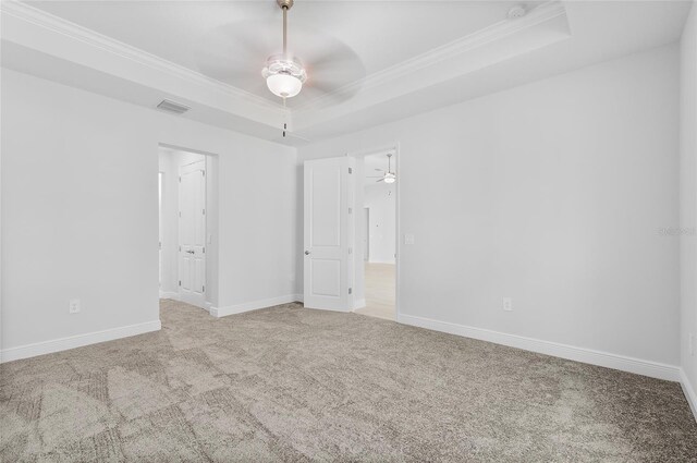 304 N Jungle Rd, Geneva, FL 32732 - unfurnished room featuring a ceiling fan, a raised ceiling, ornamental molding, carpet floors, and baseboards