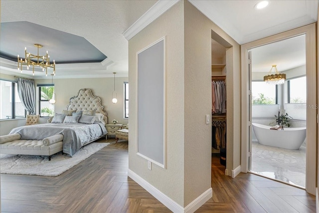 3924 SW 189th Ave, Miramar, FL 33029 - bedroom with a chandelier, a walk in closet, ornamental molding, baseboards, and a closet