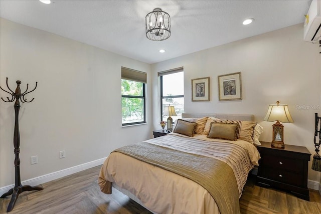 3924 SW 189th Ave, Miramar, FL 33029 - bedroom featuring baseboards, a chandelier, a wall mounted AC, and recessed lighting