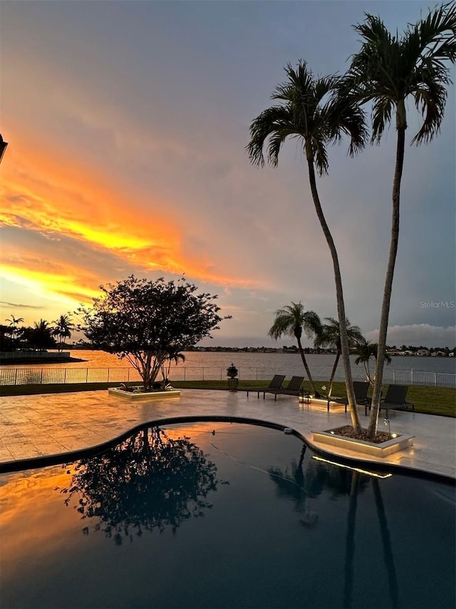 3924 SW 189th Ave, Miramar, FL 33029 - pool at dusk with fence and a patio area