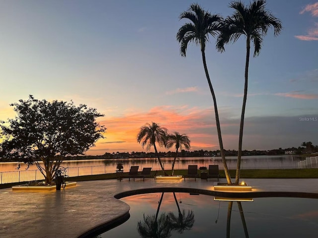 3924 SW 189th Ave, Miramar, FL 33029 - pool at dusk with a water view and fence