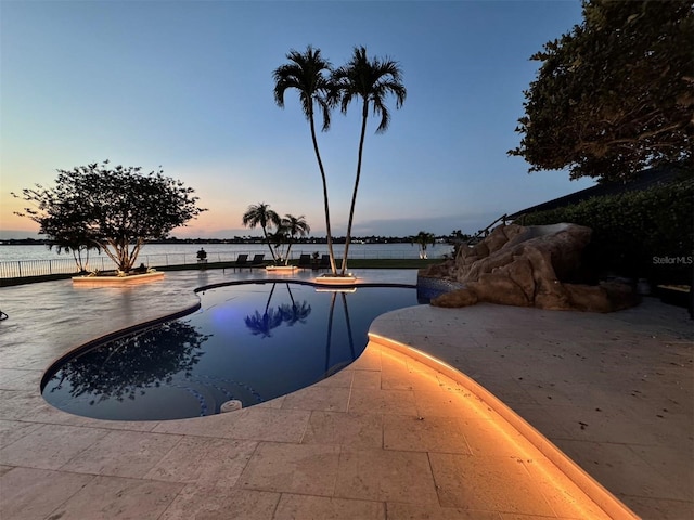 3924 SW 189th Ave, Miramar, FL 33029 - view of swimming pool featuring a water view, a patio, and fence