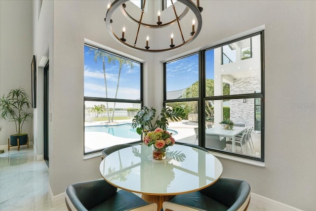 3924 SW 189th Ave, Miramar, FL 33029 - dining space featuring baseboards and a chandelier
