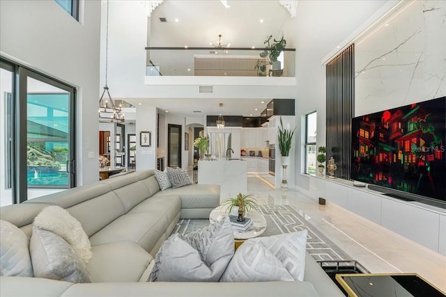 3924 SW 189th Ave, Miramar, FL 33029 - living area with a towering ceiling and a chandelier