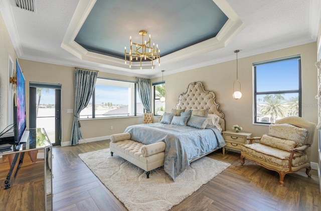3924 SW 189th Ave, Miramar, FL 33029 - bedroom with a tray ceiling, a chandelier, multiple windows, ornamental molding, and baseboards
